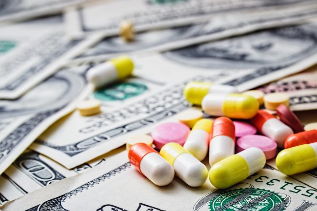 Expensive medicine. Medical insurance. Addiction. Money and pills.